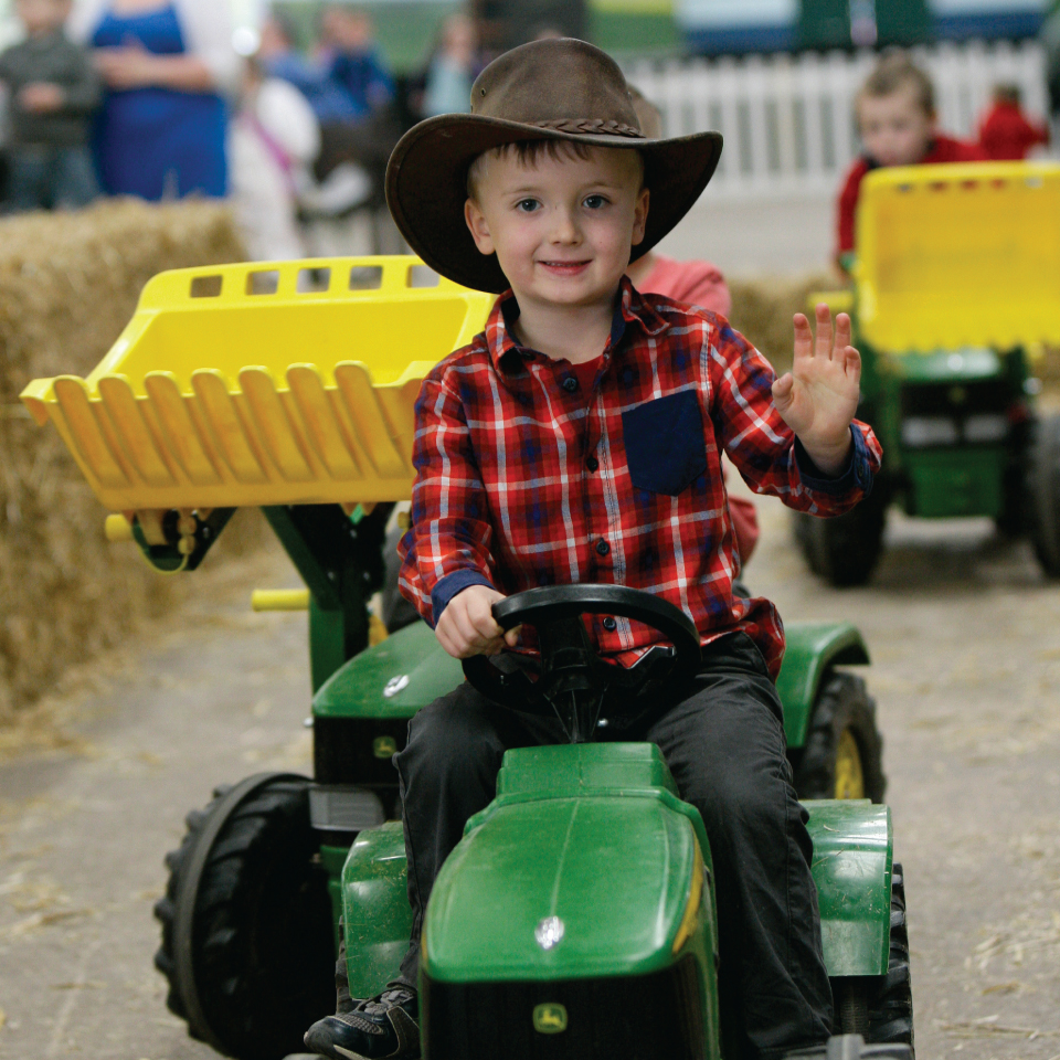 Countrytastic boy on tractor